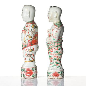 Three Chinese famille verte figures of laughing boys 'Hehe Erxian', 18th century.