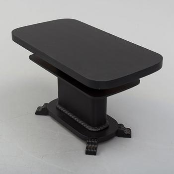 a coffee table from the first half of the 20th century.