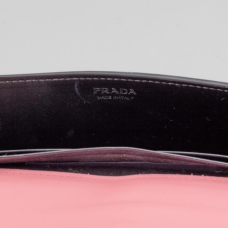A Prada leather mini bag " Cahier" with metal details and rivets. Marked "Prada Milano". Authenticity card included.