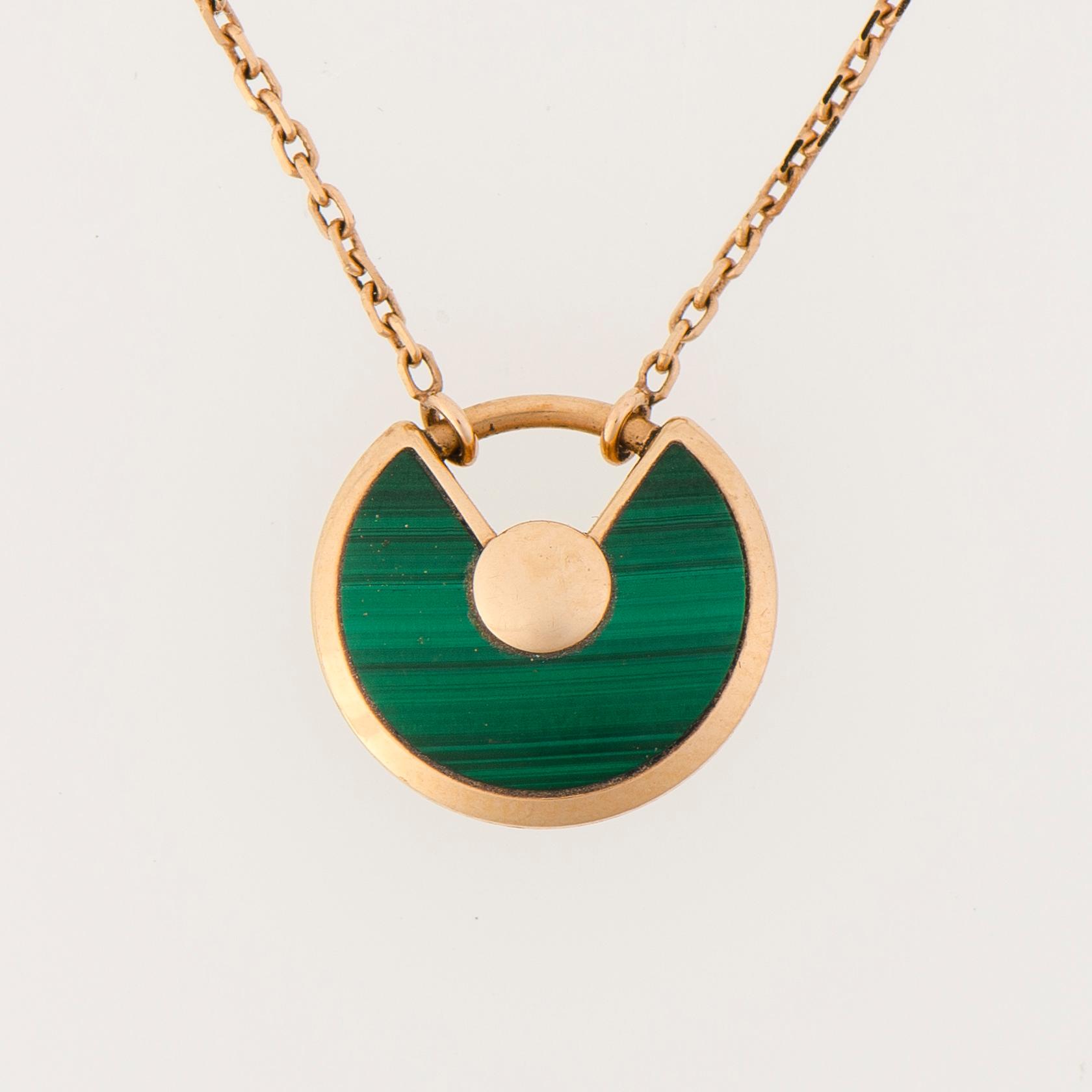 A CARTIER NECKLACE, "Amulette de Cartier", malachite, diamond, 18K gold. 2017.