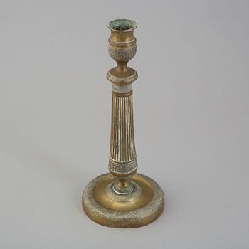 A first half of the 19th century Empire bronze candlestick.