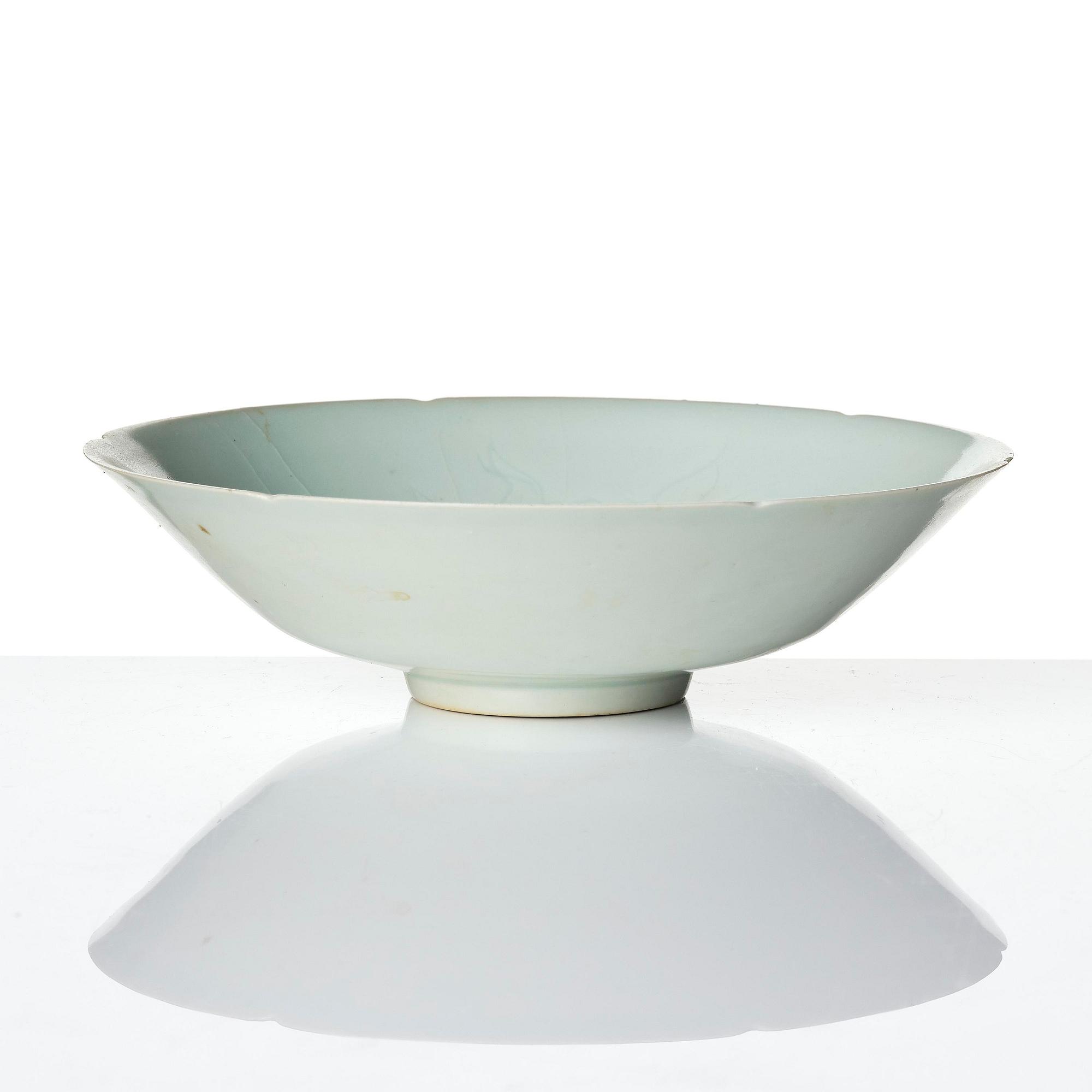 A carved qingbai foliate bowl, Song dynasty (960-1279).