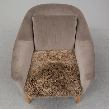 KERSTIN HÖRLIN-HOLMQUIST, a 'Napoleon' easy chair, Nyköping, Nordiska Kompaniet, mid 20th century.