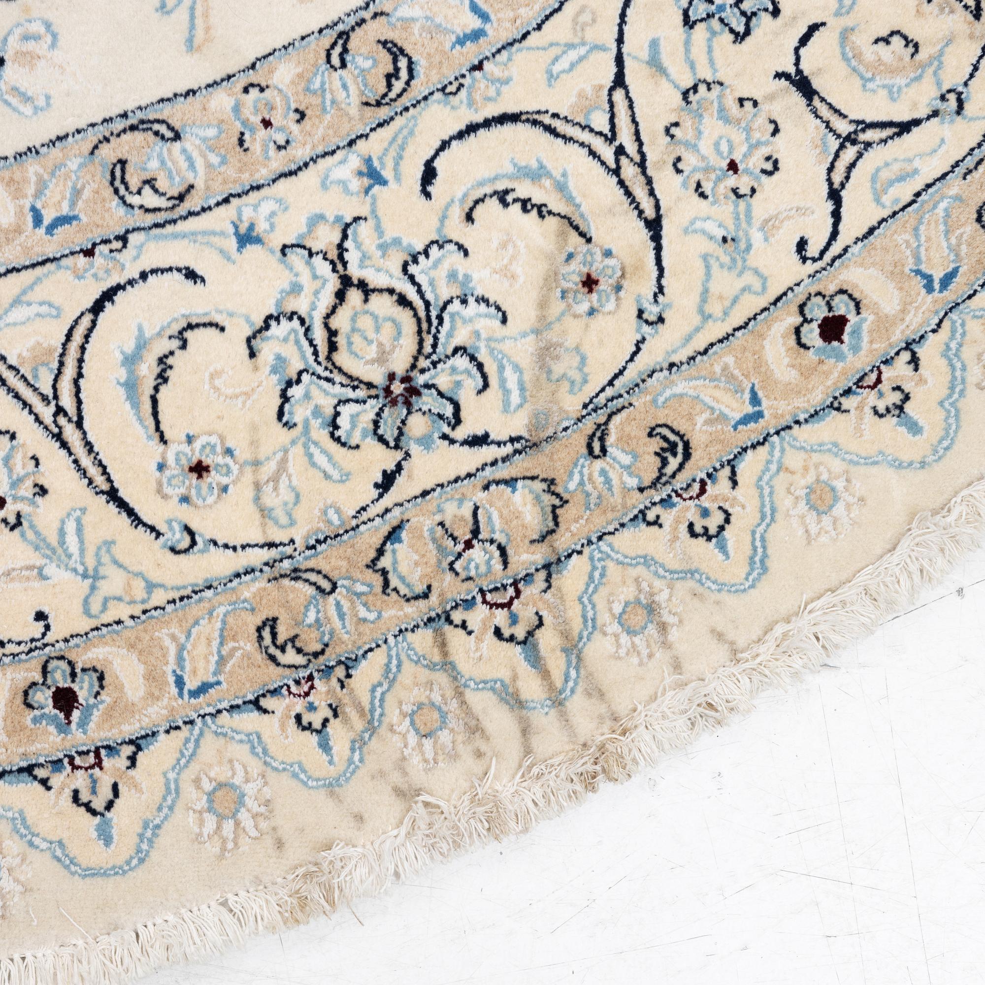 A Nain rug, diameter a. 247 cm.