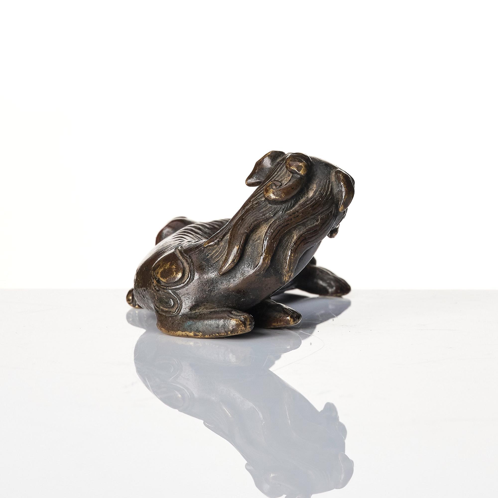 A group of four bronze figures, Ming dynasty and older.