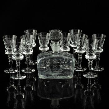 A set of 11 wine glasses and a bottle with stopper, 1900-tal.