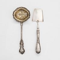 A silver server and a parcel-gilt tea strainer, St. Petersburg 1855 and 1898-1903.