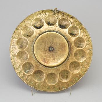 A probably 17th century brass wall plaque.