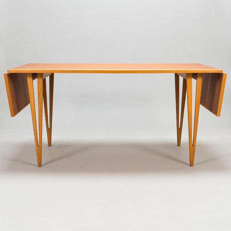 A mid-20th century dining table.