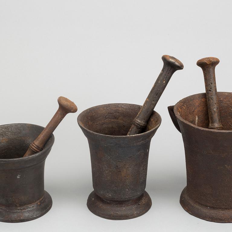 A set of three cast iron mortars around 1900.