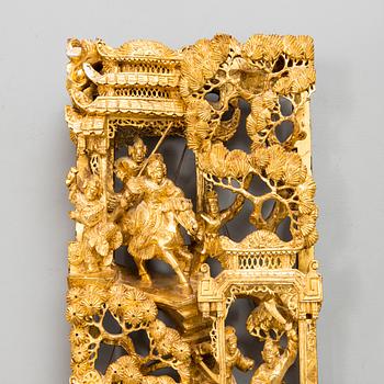 A Chinese carved and gilt wood panel, 20th century.