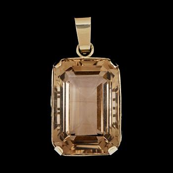 44. A smoky quartz, circa 65.00 cts, pendant.