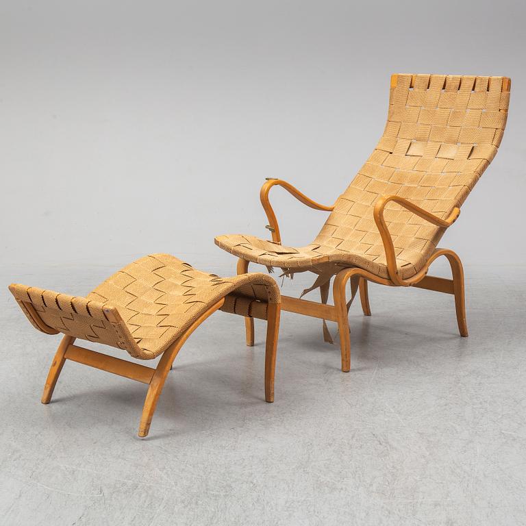 An mid 20th Century easy chair  and stool by Bruno Mathsson for Karl Mathsson Värnamo.
