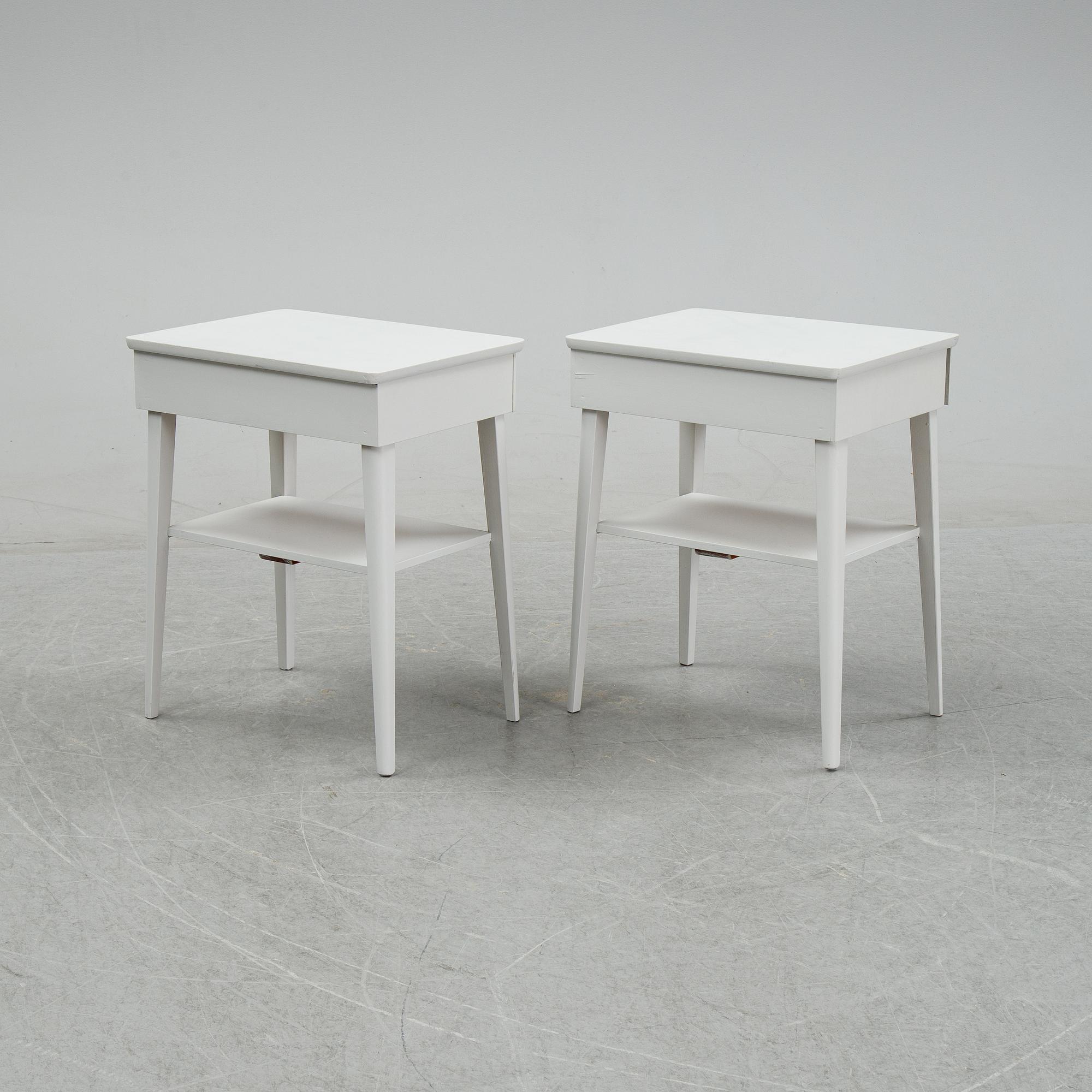 A pair of mid 20th century bedside tables.