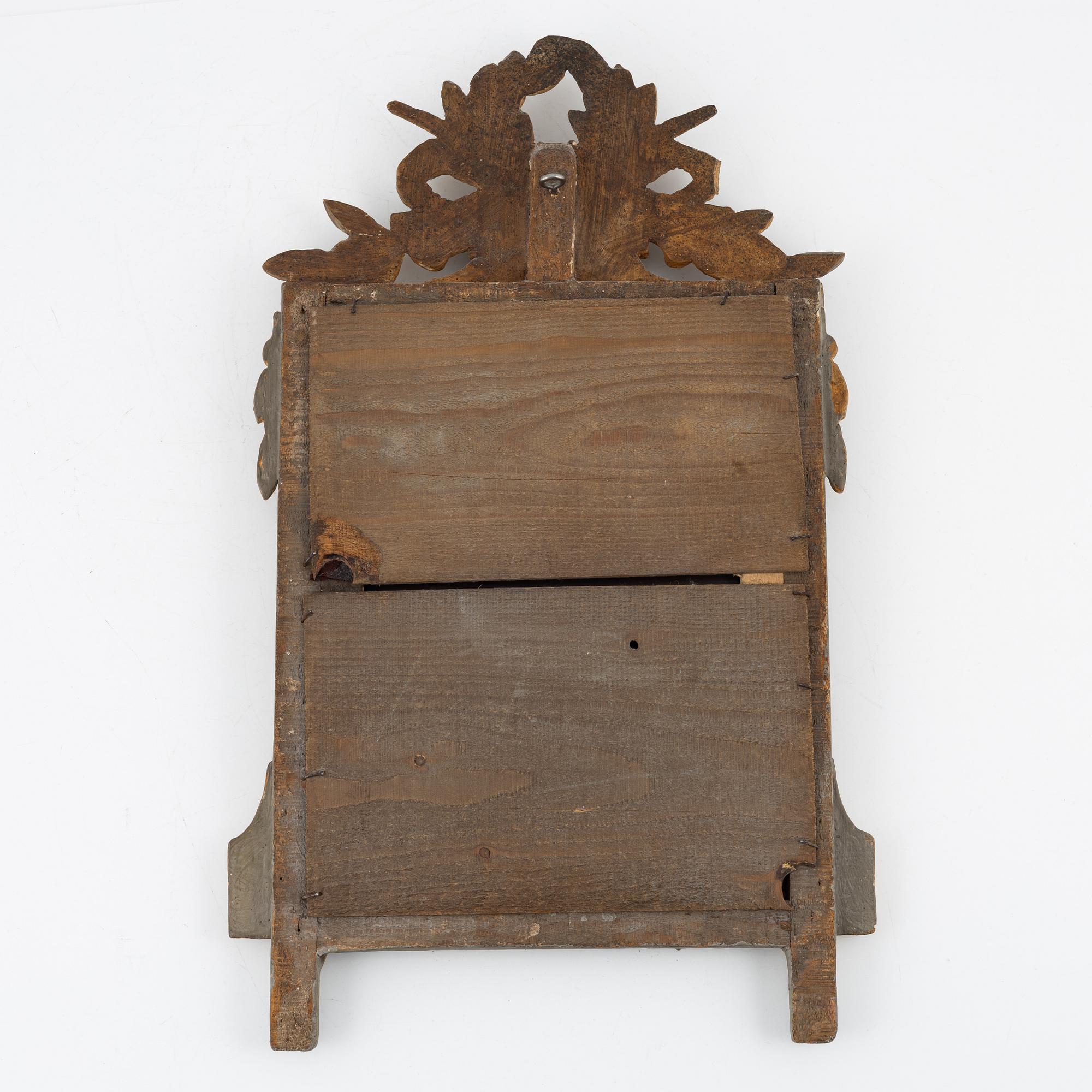 A Gustavian style mirror, around the year 1900.