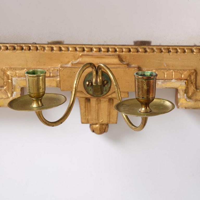A Gustavian giltwood two-light girandole mirror by J. Åkerblad (master in Stockholm 1754-99).