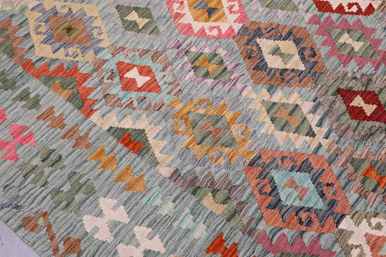 A Kilim rug, approx. 298 x 248 cm.