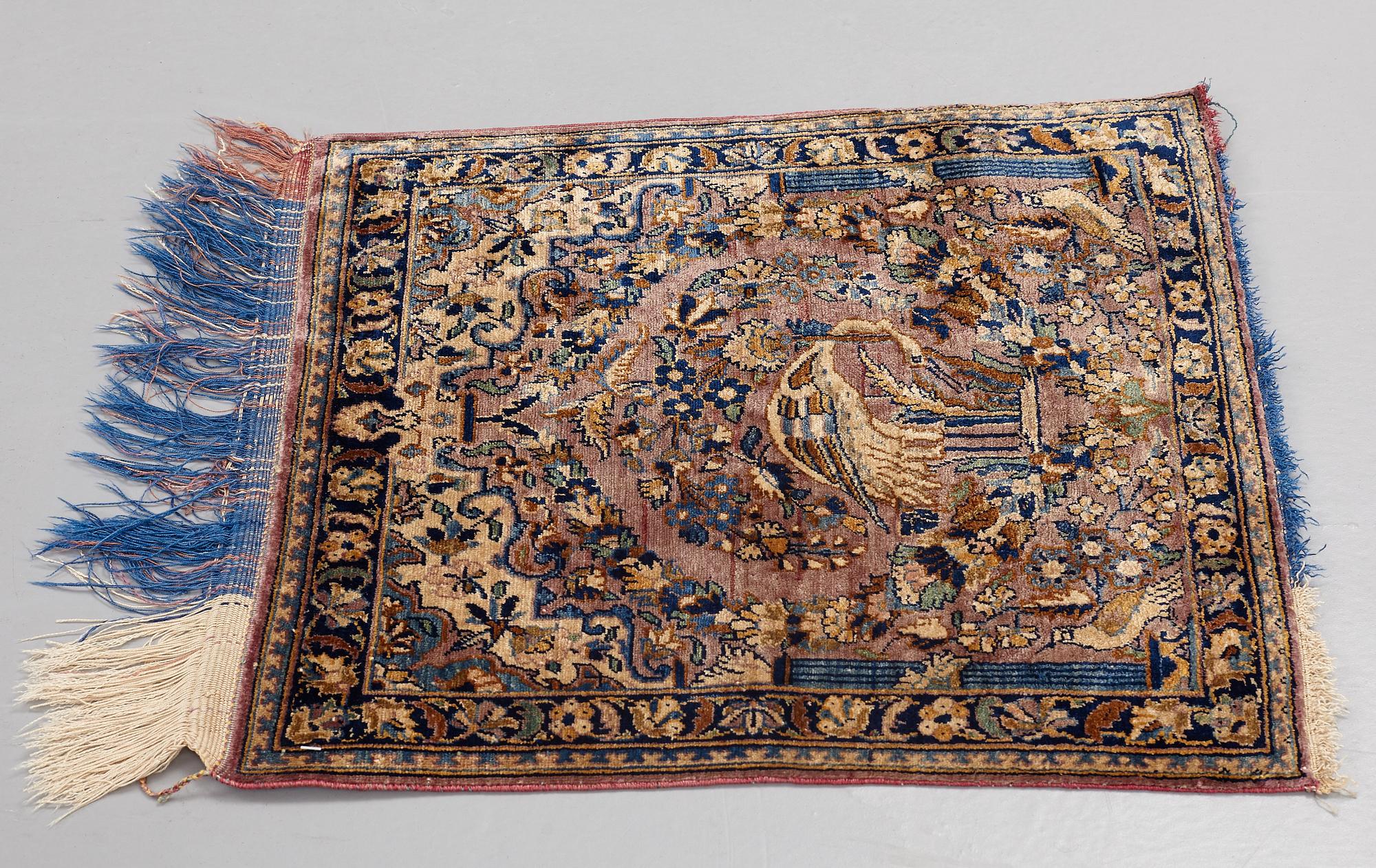 MATTO, a semi-antique silk Kashan possibly Motachem, ca 51-52,5 x 48.5-51 cm.