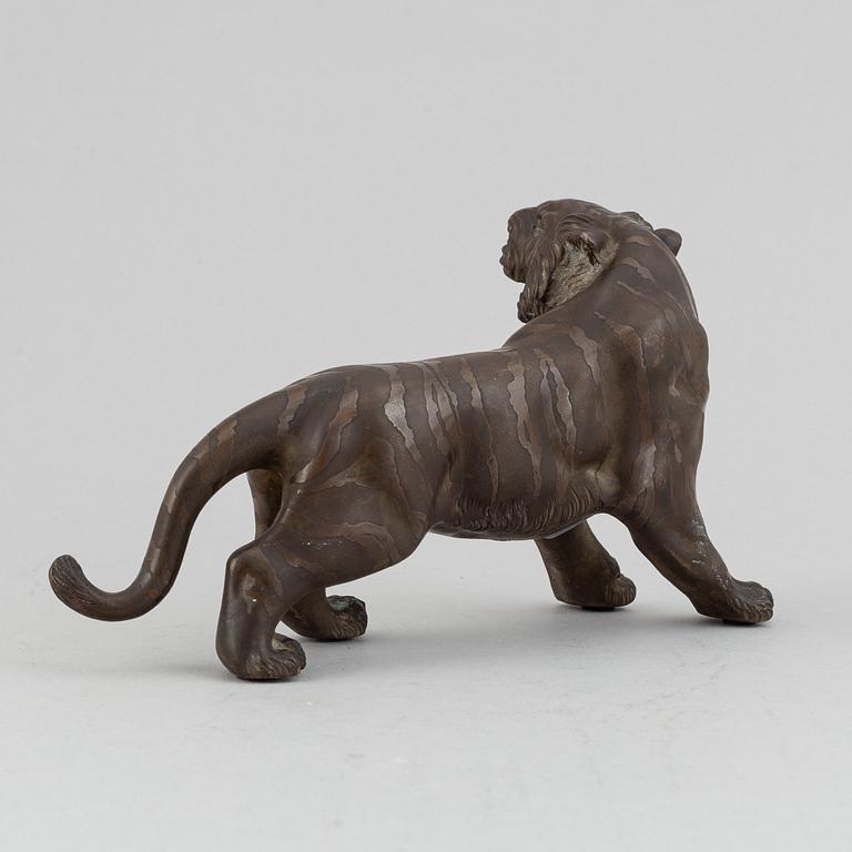 A Japanese bronze okimono in the shape of a tiger, Meiji period (1868-1912), late 19th century. Signed 'Mitani'.