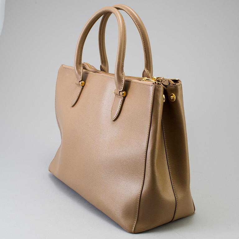 a "Newbury Double-Zip Satchel" bag by Ralph Lauren.
