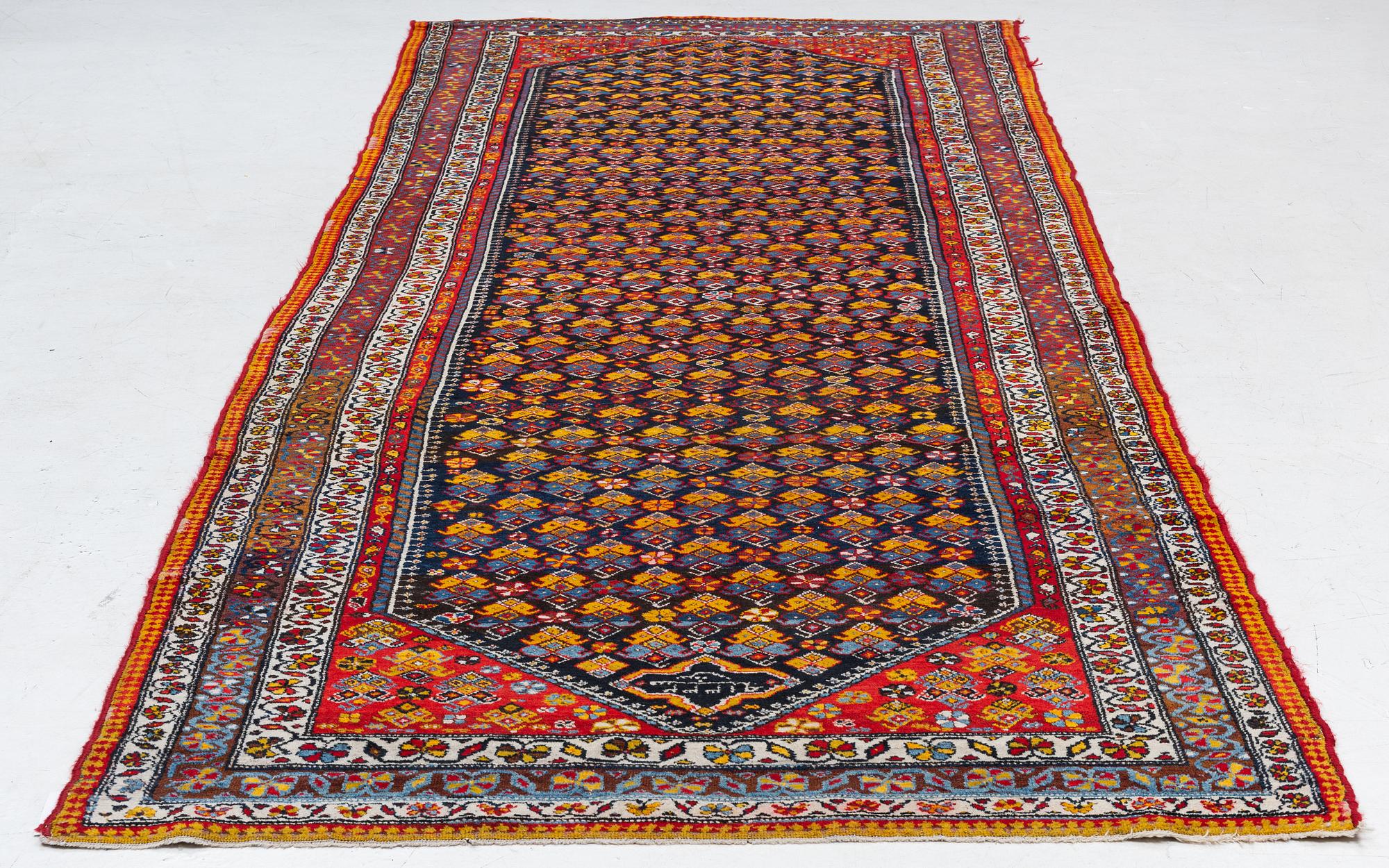 A semi-antique Hamadan, Western Persia, c. 421 x 145 cm.