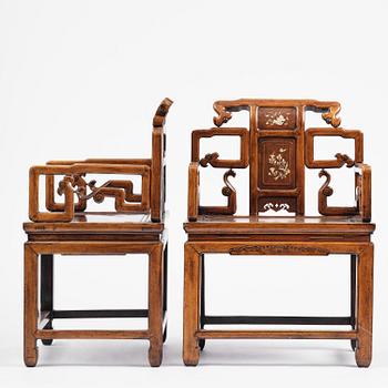 A pair of hardwood armchairs, late Qing dynasty.