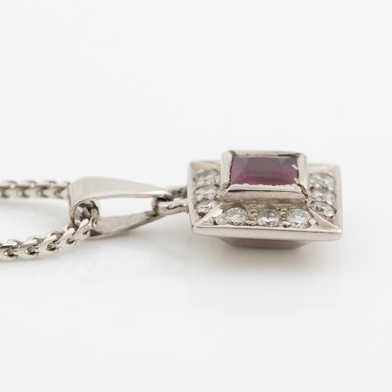 Pendant with chain in 18K white gold featuring a red stone, likely a ruby, and diamonds.