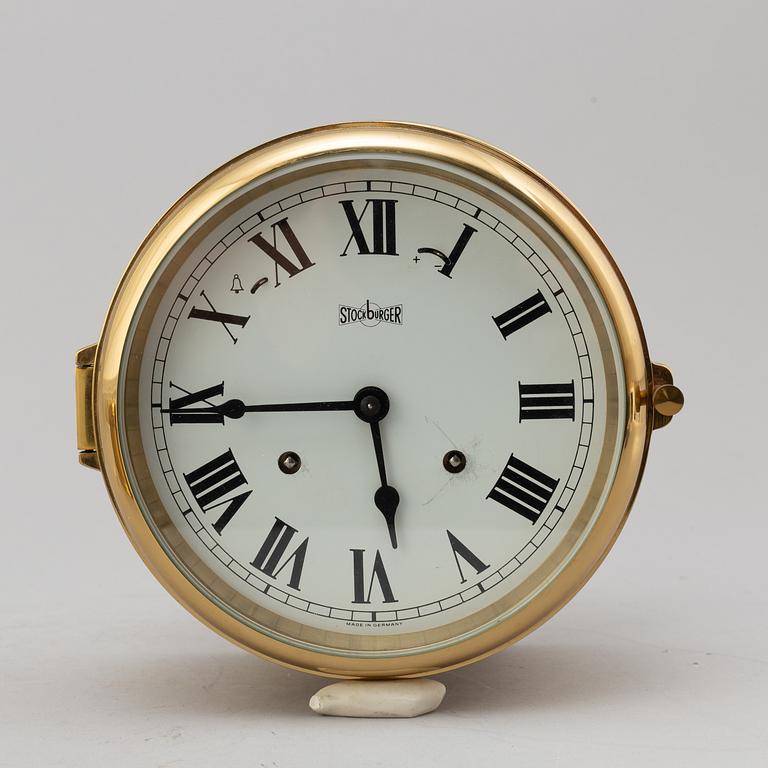 A BRASS MARINE CLOCK AND BAROMETER BY STOCKBURGER.