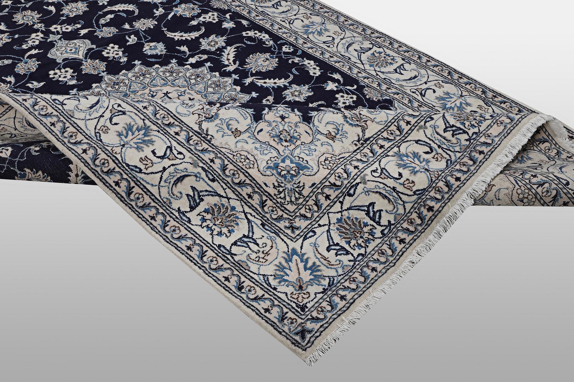 A carpet, Nain, part silk, ca 310 x 205 cm.