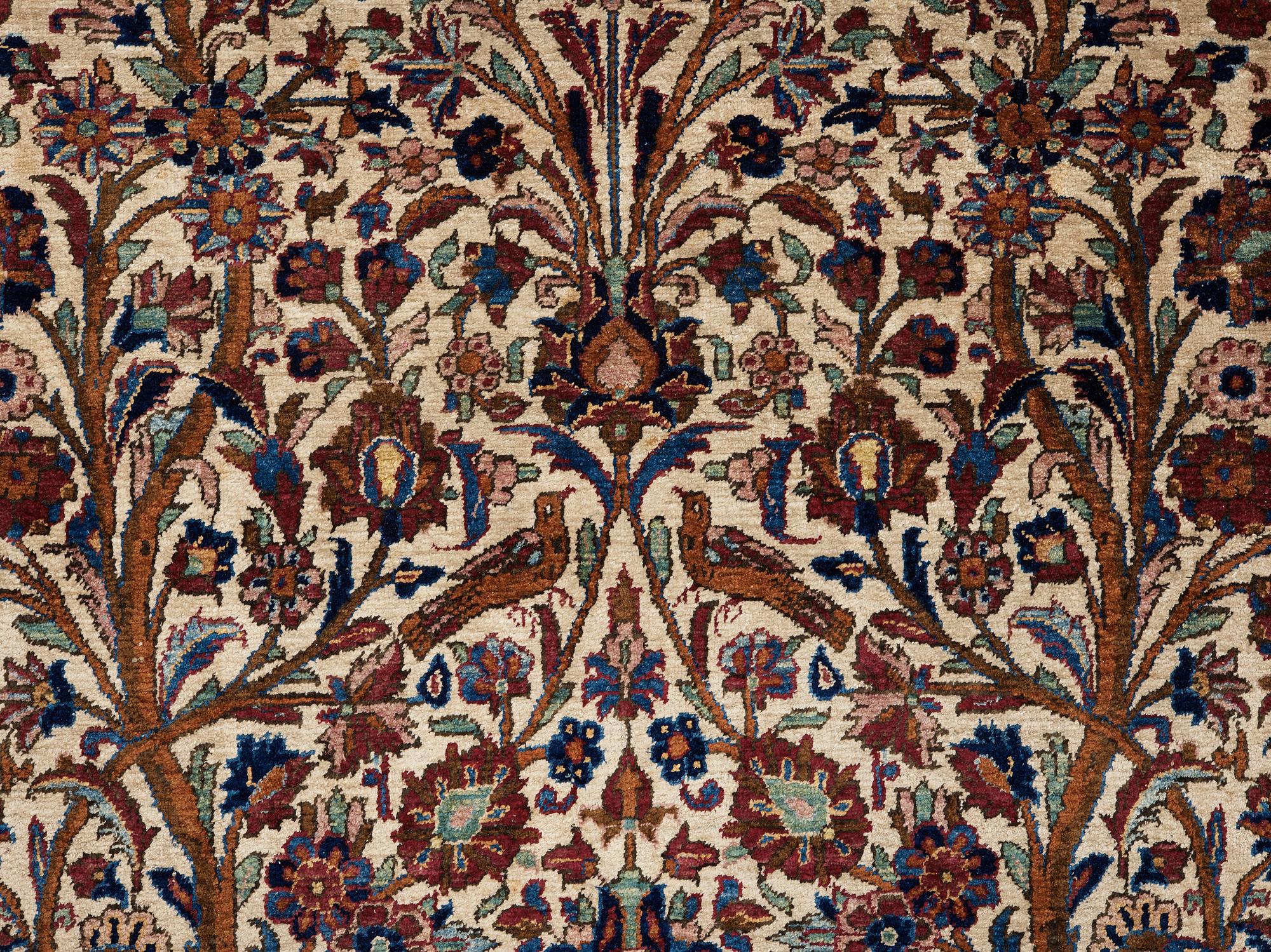 A RUG. A semi-antique silk Kashan. 205,5 x 131,5 cm.