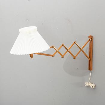 A teak wall lamp by Erik Hansen, Le Klint, Denmark.