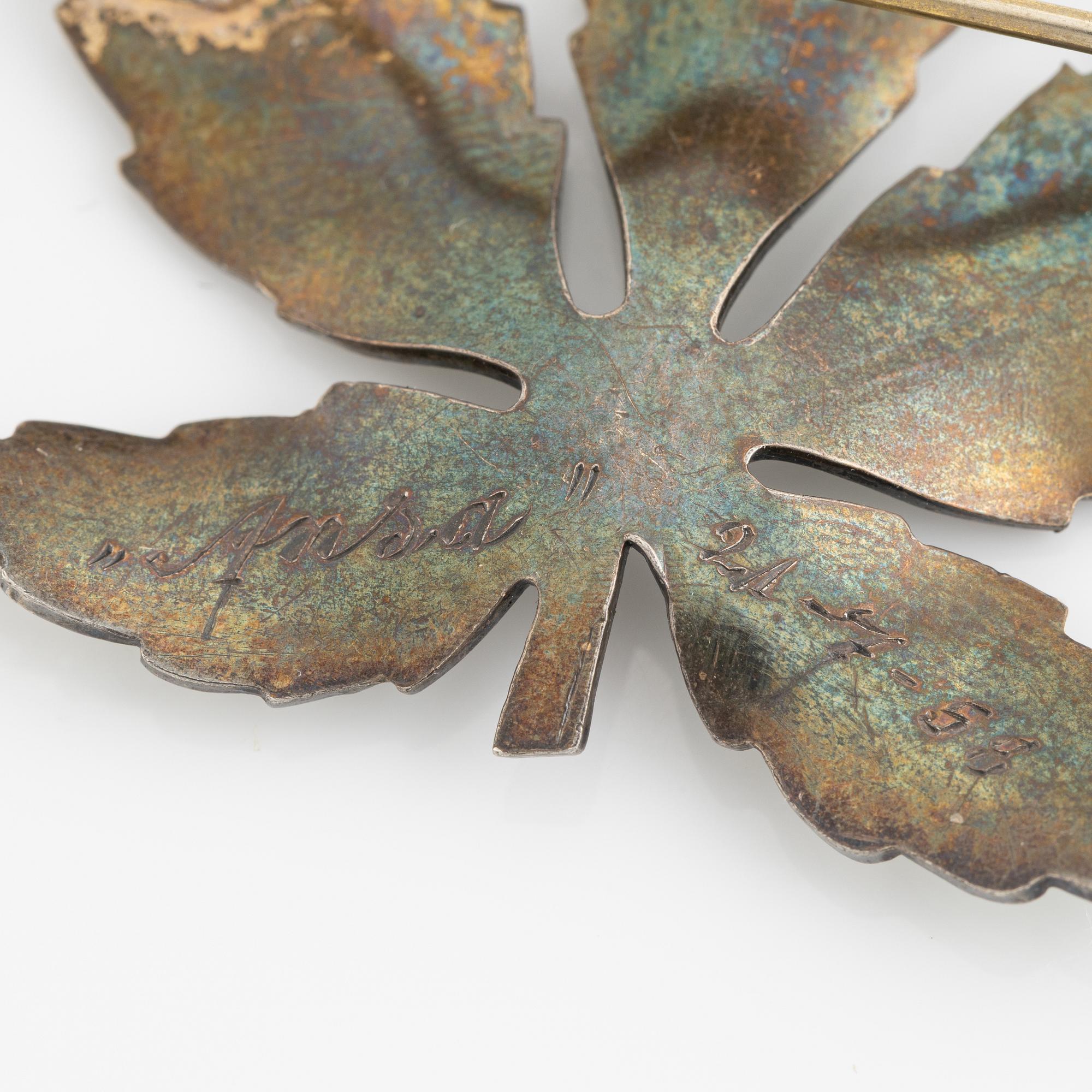 Two silver and enamel brooches, one by David Andersen, Norway.