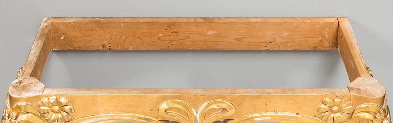 An Art Nouveau mirror with console table from early 20th century.