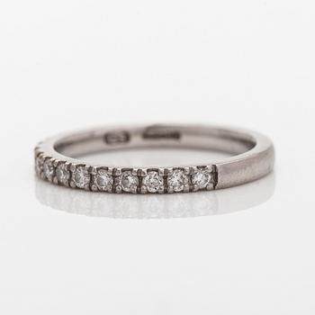 A platinum ring with brilliant cut diamonds.