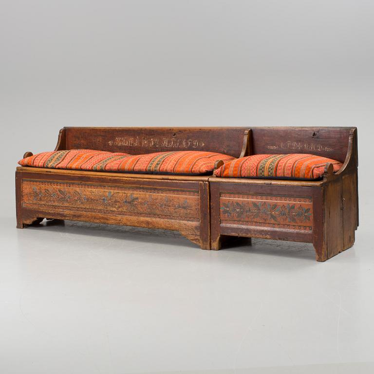 A traditional folk art sofa dated 1852.