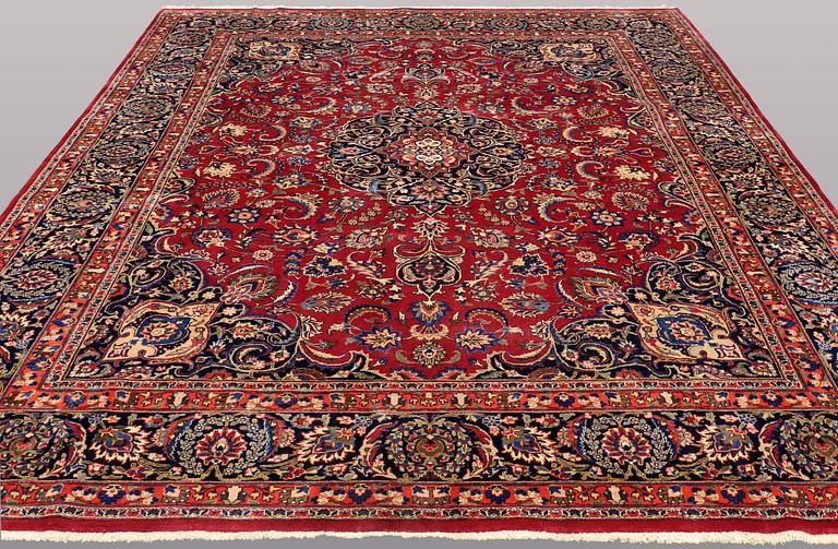 A CARPET, Mashad, signed, ca 385 x 293 cm.