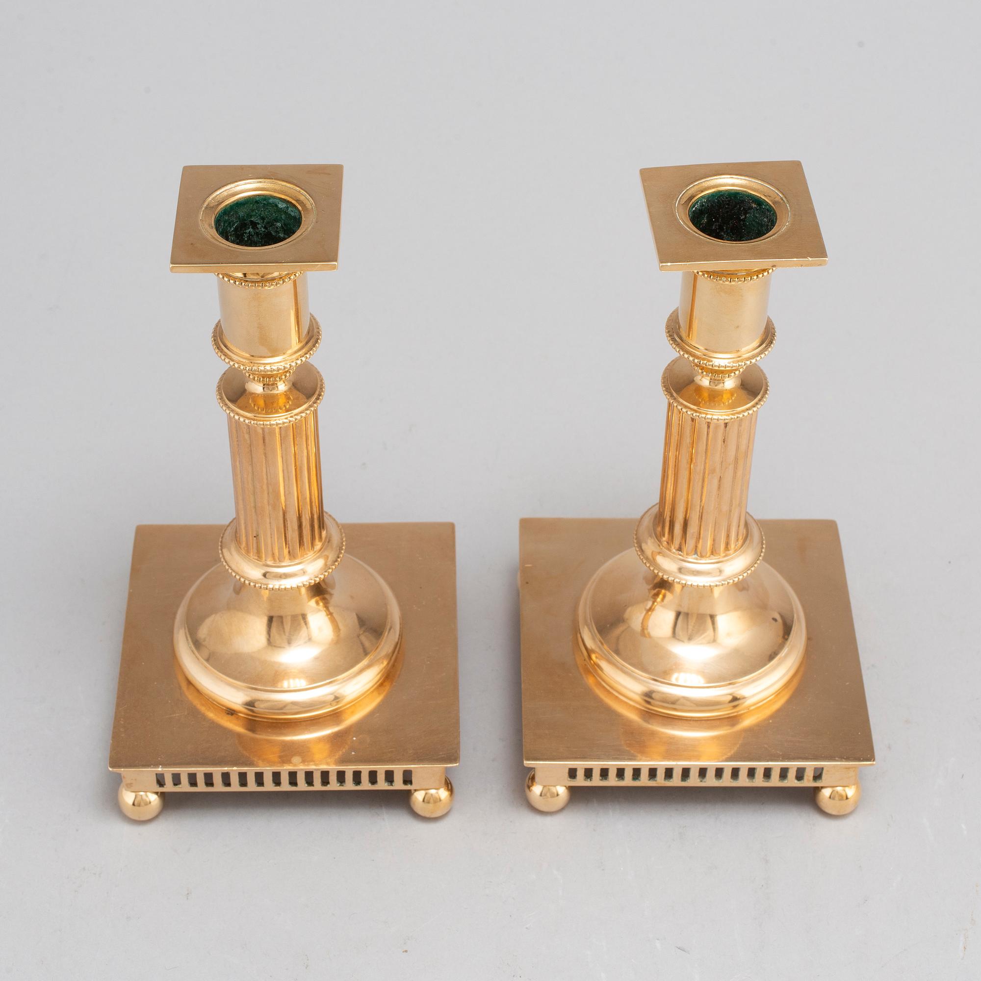 A pair of model 38 brass candlesticks from Gusums Bruk, first half of the 20th century.
