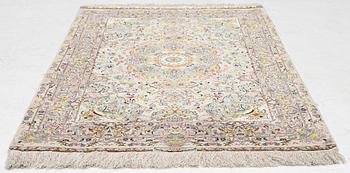 A Tabriz rug, signed, c. 160 x 101 cm.