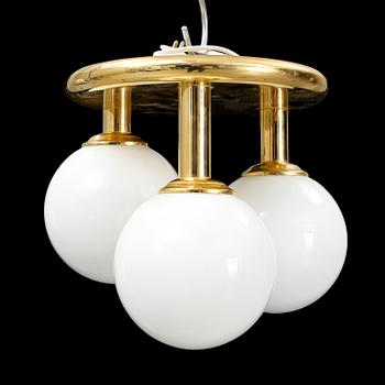 A contemporary brass and glass ceiling light.