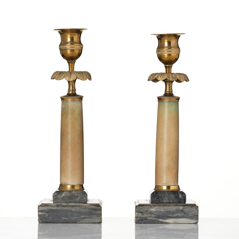 A pair of late Gustavian gilt brass and marble candlesticks, Stockholm, late 18th century.
