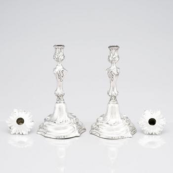 Two Swedish Rococo silver candlesticks, marks of Jakob Lampa, Stockholm 1764 and 1778.