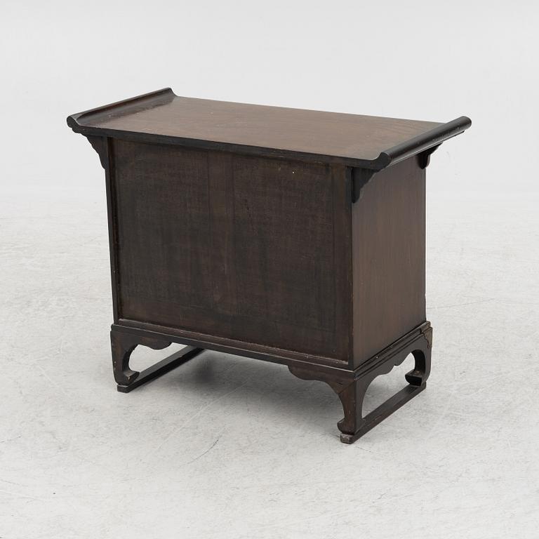 A Chinese hardwood cabinet, early 20th century.