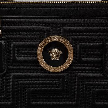 Versace, a black quilted leather handbag.