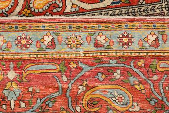 A carpet, semi-antique, Qum, ca 318 x 233 cm.