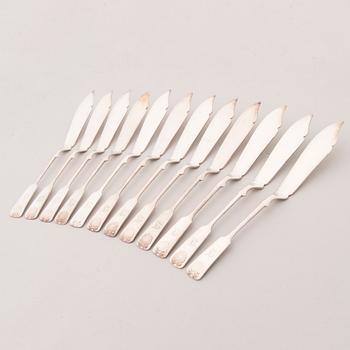 A set of 24 silver plate fish knives and forks with seashell decoration, Kultakeskus Oy, Finland 20th Century.