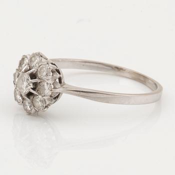 An 18K white gold ring set with round brilliant cut diamonds.