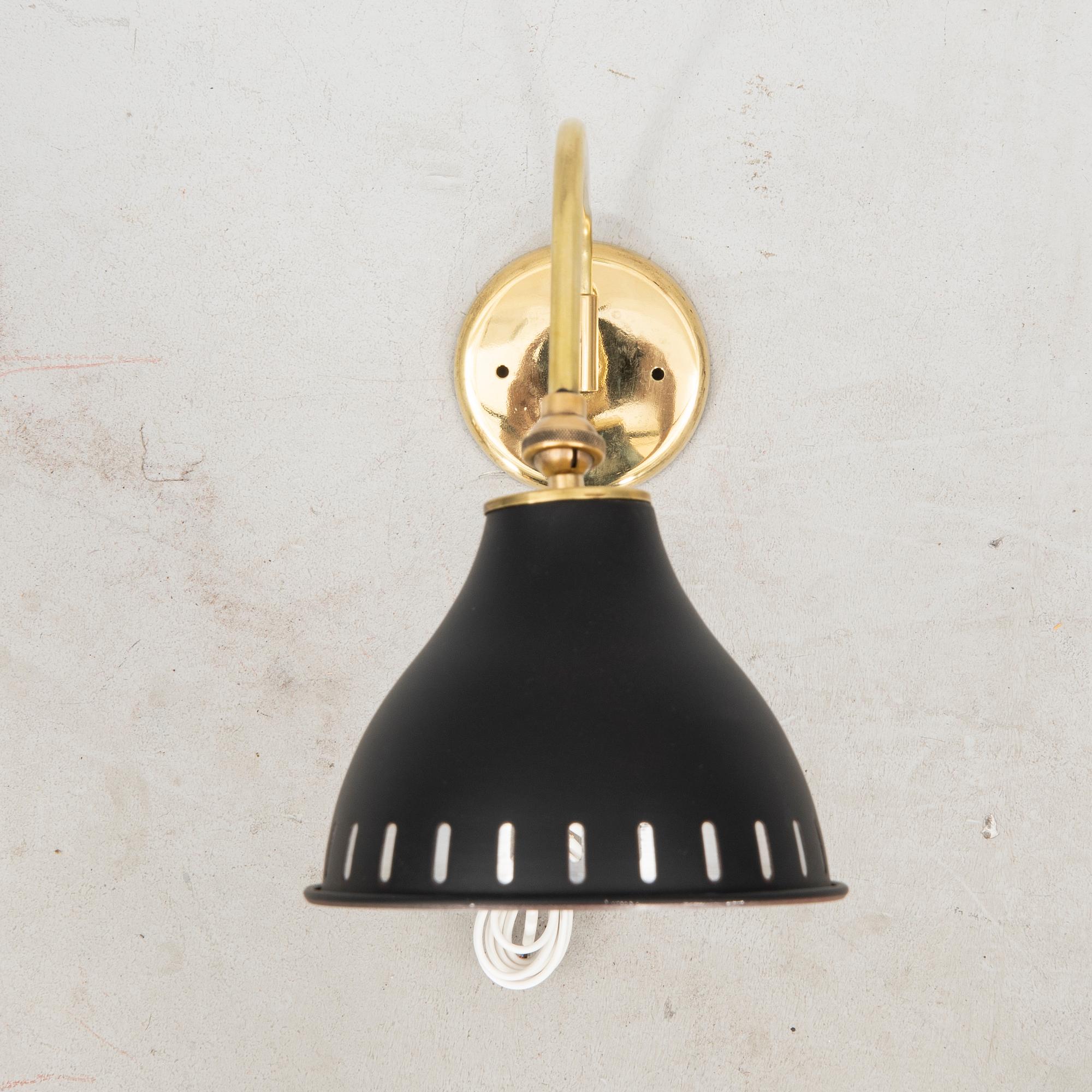 A bras wall lamp later part of the 20th century.
