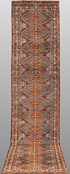 An oriental runner, c. 386 x 78 cm.