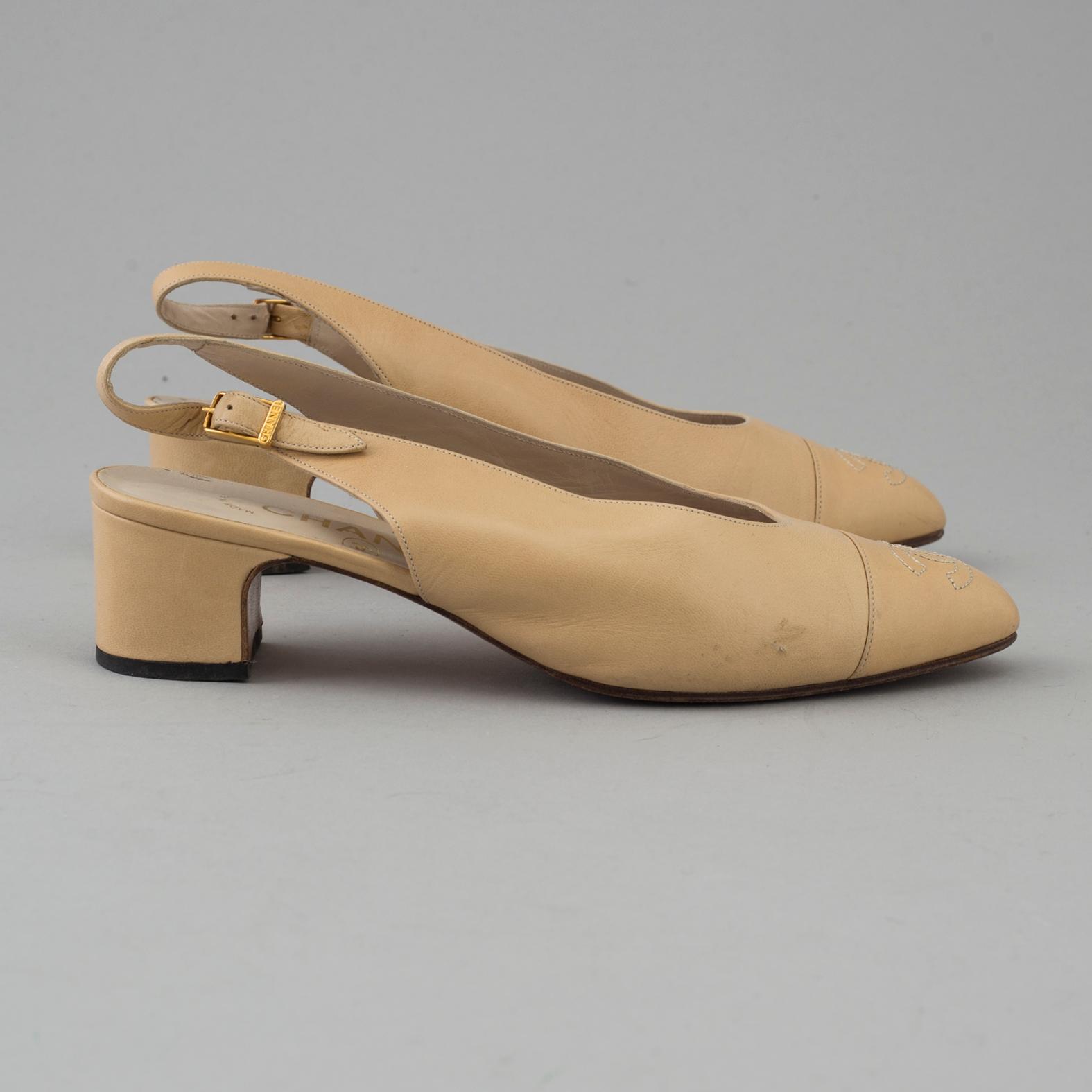 Beige leather slingbacks by Chanel.