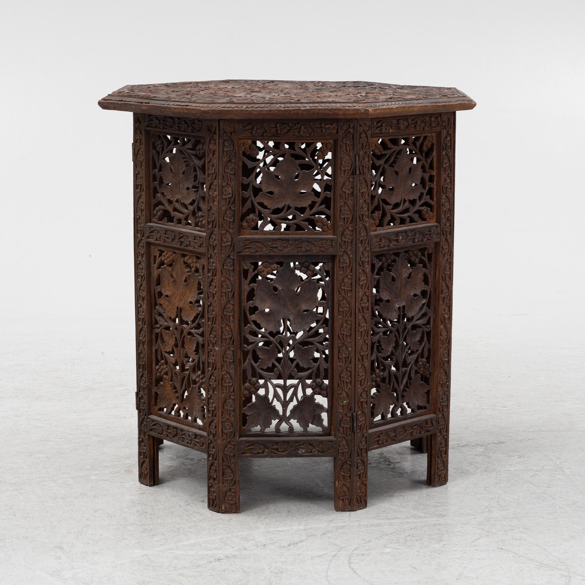 A carved table, first half of the 20th Century.